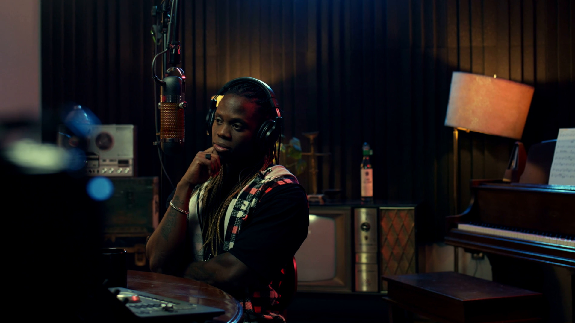 A professional participating in a video podcast with a studio microphone